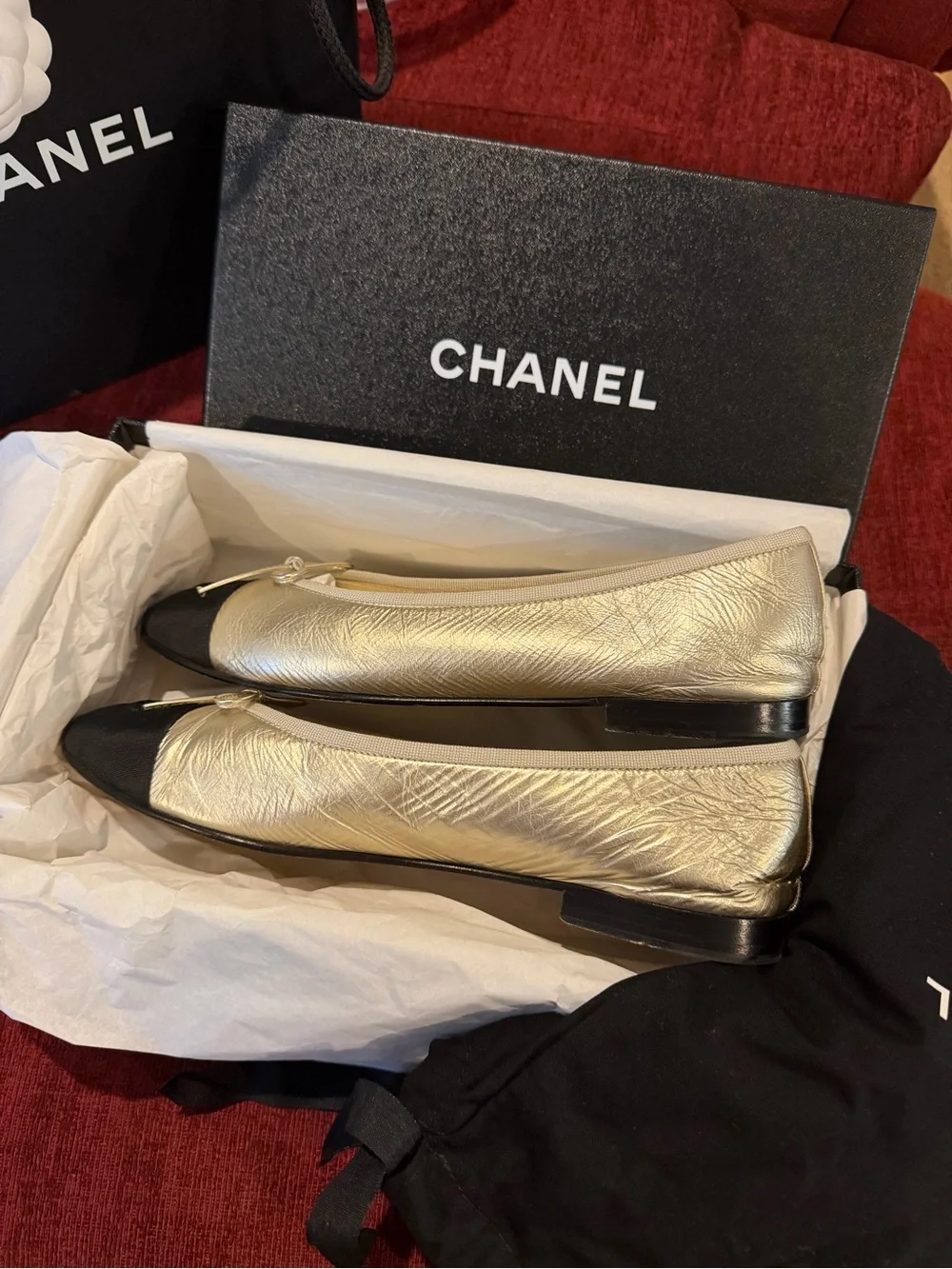 CHANEL Gold Leather Ballet Flats with Black Cap Toe Winter 2025 Season